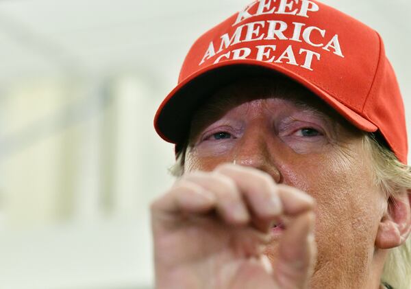 March 6, 2020 Atlanta - President Donald Trump speaks to members of the press at the headquarters of the Centers for Disease Control and Prevention in Atlanta on Friday, March 6, 2020. President Donald Trump visited  the headquarters of the Centers for Disease Control and Prevention in Atlanta on Friday after all, after initially scrapping the trip over concerns that a staffer at the agency had contracted the coronavirus. (Hyosub Shin / Hyosub.Shin@ajc.com)