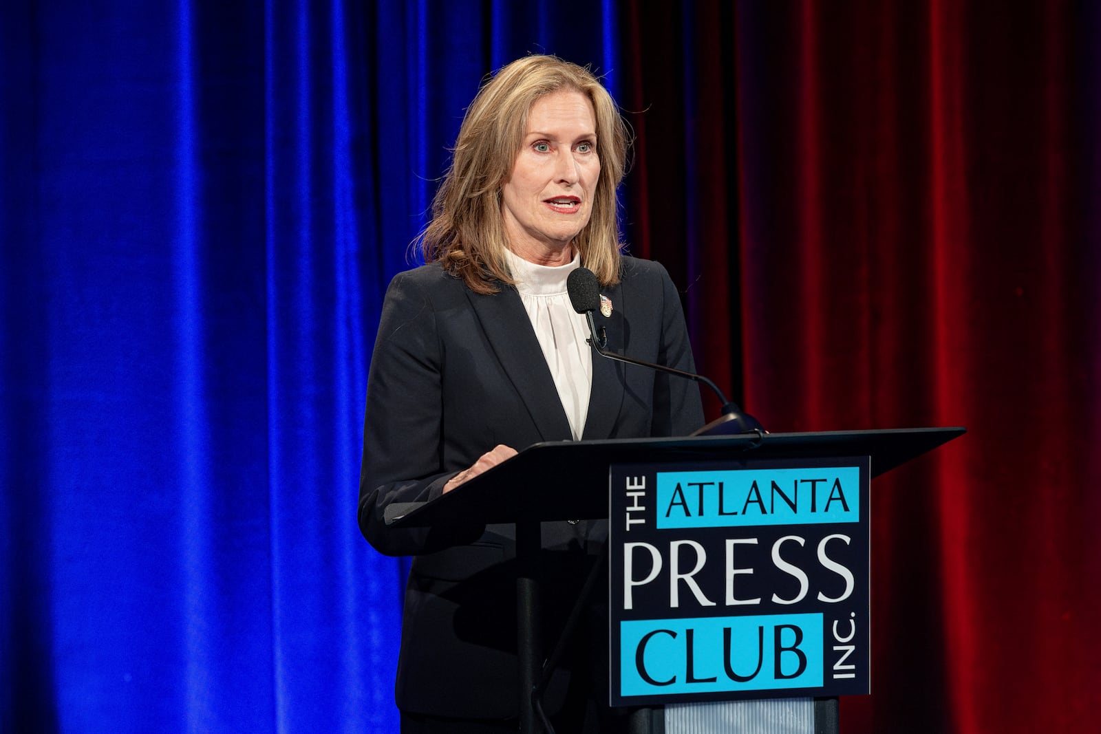 Democrat Maura Keller makes a point during an Atlanta Press Club debate in Atlanta, Sunday, Oct. 13 with Republican Brian Jack, her fellow candidate in the race for Georgia's open 3rd Congressional District seat. (Pool/John Glenn via AP)