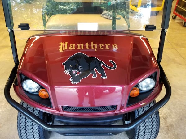 A benefactor donated a golf cart to the Forest Park football program and had its painted wine and gold, the school's colors.