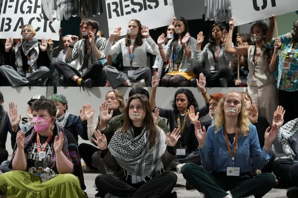 Activists participate in a demonstration at the COP29 U.N. Climate Summit, Saturday, Nov. 23, 2024, in Baku, Azerbaijan. (AP Photo/Sergei Grits)