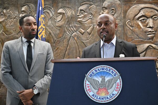 February 3, 2022 Atlanta - Atlanta Housing Authority President Eugene Jones speaks as Mayor Andre Dickens looks during a press conference at Atlanta City Hall on Thursday, February 3, 2022. (Hyosub Shin / Hyosub.Shin@ajc.com)