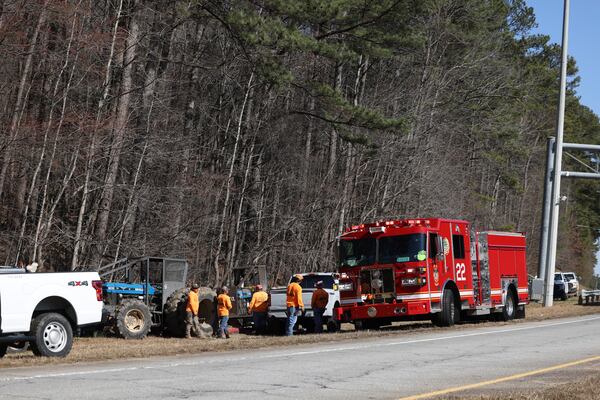 Multiple agencies, shown on the side of the Hugh Howell Road exit ramp from Stone Mountain Freeway, battle a brush fire outside of Stone Mountain Park.