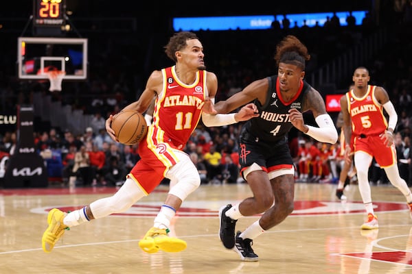 Atlanta Hawks guard Trae Young (11) drives against Houston Rockets guard Jalen Green (4) during the fourth quarter at State Farm Arena, Wednesday, October 19, 2022, in Atlanta. The is the Atlanta Hawks opener for the 2022-2023 season. (Jason Getz / Jason.Getz@ajc.com)