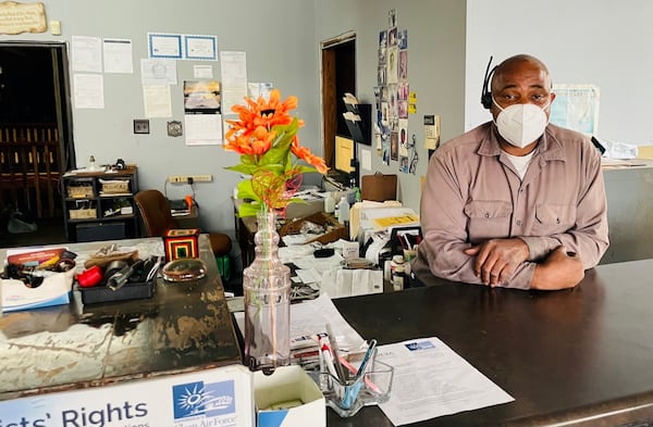 Joe Peters owns an auto repair shop across Donald Lee Hollowell Parkway from where new townhomes are being built. Photo by Bill Torpy