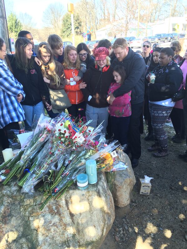 Alexia Hyneman’s friends and family gathered for a vigil in 2016 near the site of the crash that killed the Grady High School student. CARRIE TEEGARDIN / CARRIE.TEEGARDIN@AJC.COM