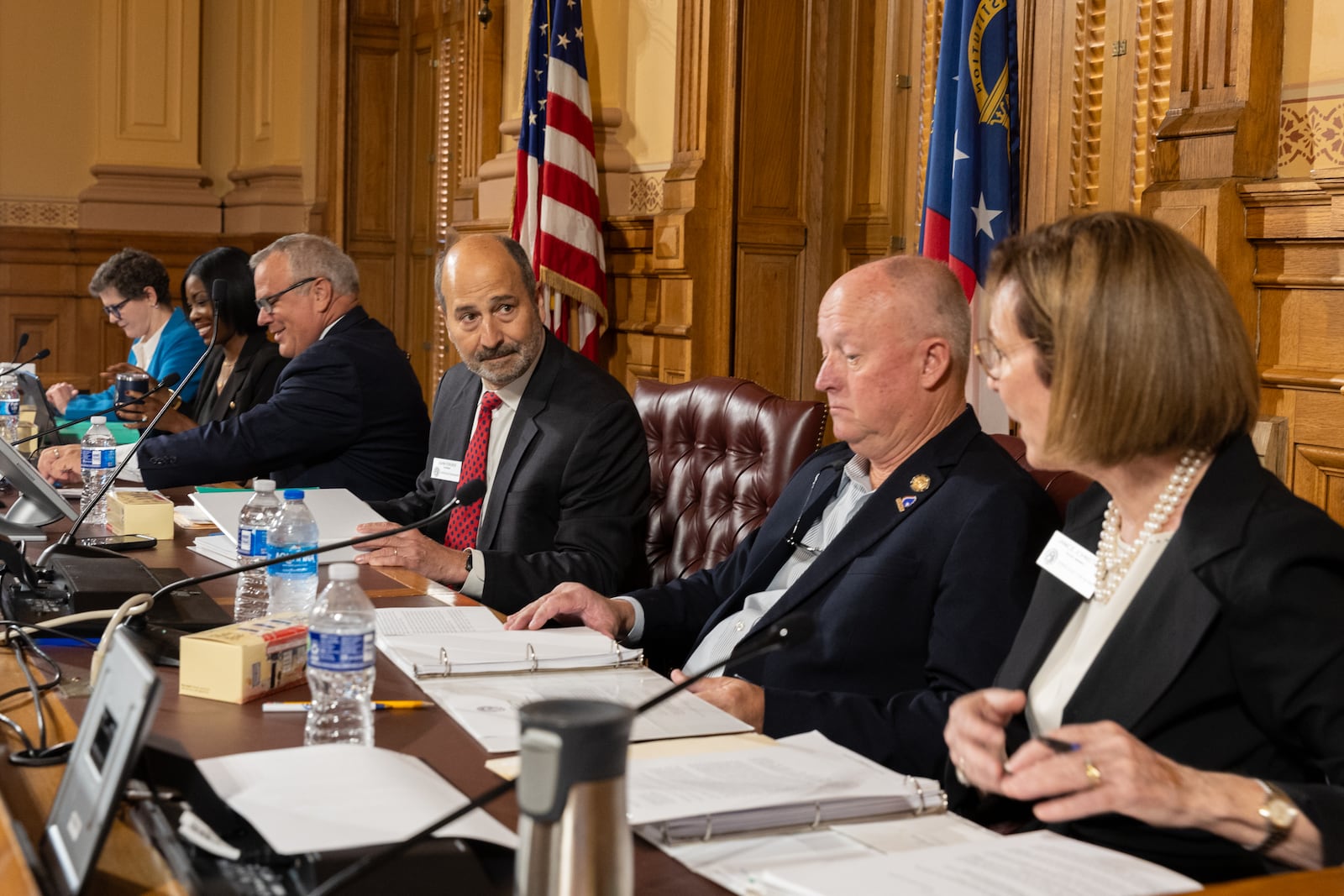 (L-R) Georgia Election Board member Sara Tindall Ghazal, member Janelle King, executive director Mike Coan, chairman John Fervier, member Rick Jeffares, and member Janice Johnston appear before a board meeting at the Capitol in Atlanta on Friday, September 20, 2024. The election board is set to decide on sweeping rule changes less than a month before early voting begins. (Arvin Temkar / AJC)