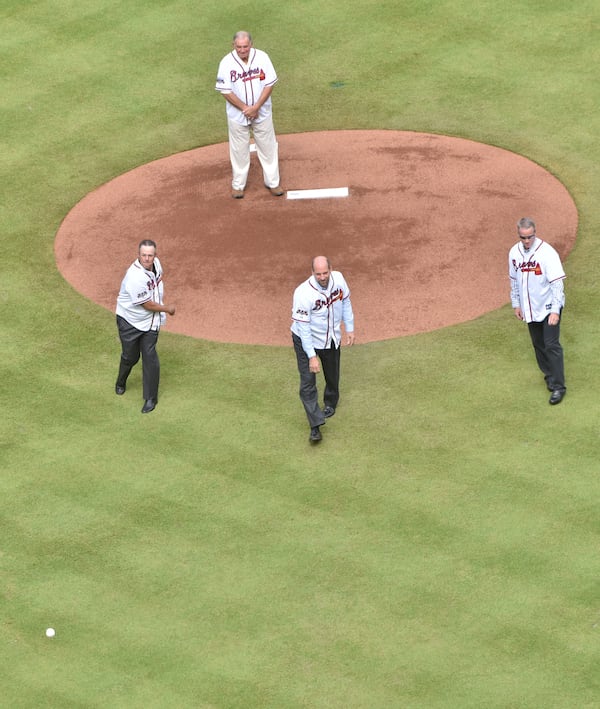 Longtime Braves pitchers (from left) Greg Maddux, John Smoltz and Tom Glavine throw first pitch as former Braves manager Bobby Cox looks during pregame ceremony before the final Atlanta Braves game against the Detroit Tigers at Turner Field on Sunday, October 2, 2016. HYOSUB SHIN / HSHIN@AJC.COM