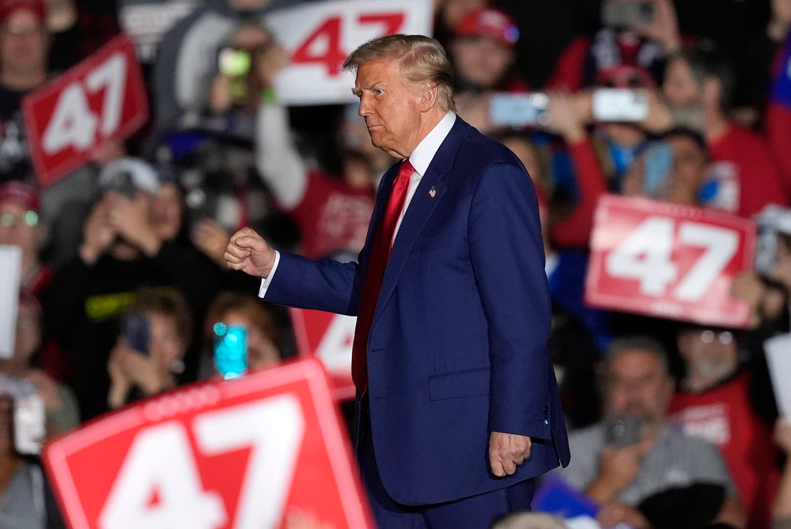 Republican presidential nominee former President Donald Trump departs after speaking during a campaign rally at the Suburban Collection Showplace, Saturday, Oct. 26, 2024 in Novi, Mich. (AP Photo/Carlos Osorio)