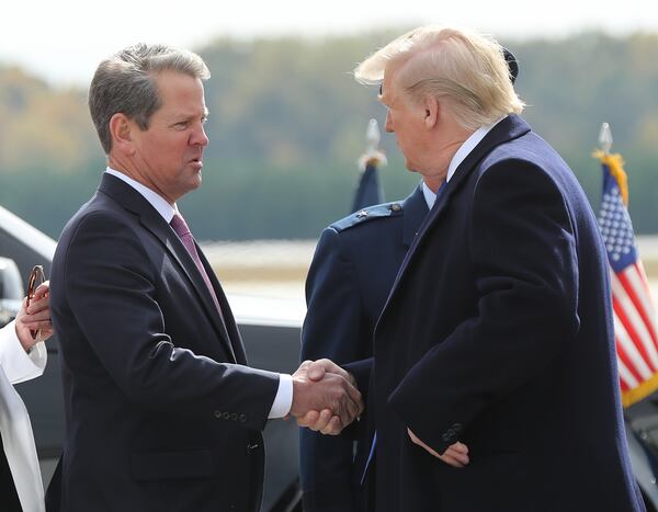 November 8, 2019 Marietta: Georgia Governor Brian Kemp greets President Donald Trump as he arrives at Dobbins AFB on Friday, November 8, 2019, in Marietta.   Curtis Compton/ccompton@ajc.com