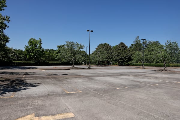 An empty parking lot on the former State Farm Campus in John's Creek on Wednesday, June 22, 2022. The vacant complex is the site of a proposed redevelopment plan for an Avalon-style shopping area. (Natrice Miller / natrice.miller@ajc.com)