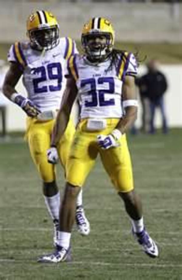 LSU cornerback Jalen Collins (32) celebrates his interception with safety Rickey Jefferson (29) during the fourth quarter of an NCAA college football game against Texas A&amp;M Thursday, Nov. 27, 2014, in College Station, Texas. LSU won 23-17. (AP Photo/David J. Phillip)