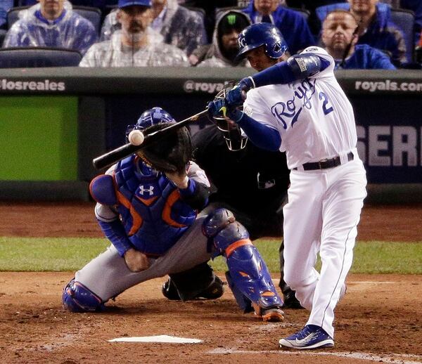 Kansas City Royals' Alcides Escobar watches his RBI single against the New York Mets during the fifth inning of Game 2 of the Major League Baseball World Series Wednesday, Oct. 28, 2015, in Kansas City, Mo. (AP Photo/Charlie Riedel)