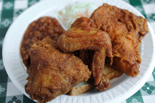 Half Chicken Plate with baked beans, slaw and white bread. (Becky Stein Photography)