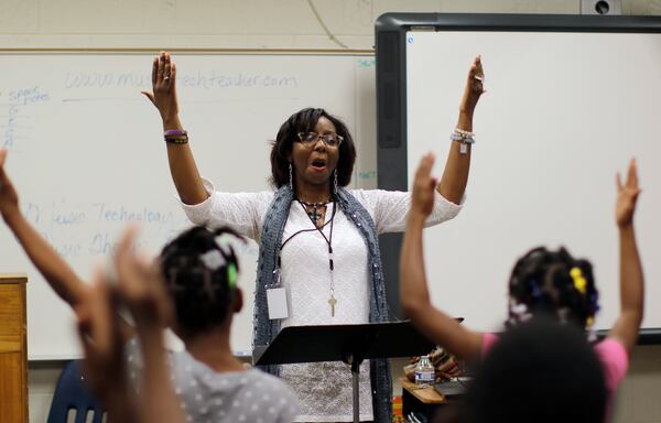 Third graders practice in Letricia Henson's music and chorus class.  Thomasville Heights Elementary School is the first school to be part of APS' outsourcing experiment.  A group called Purpose Built Schools took over the school this year. Among the changes at Thomasville are intensive instruction in reading/math; pre-K programs; daily "specials" including dance and  robotics and a team of parents working at the school to better connect staff with the community   BOB ANDRES  /BANDRES@AJC.COM