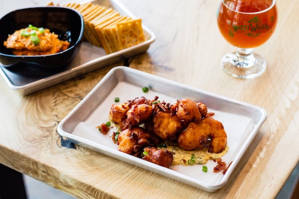 Gulf shrimp hush puppies with Tabasco tartar sauce, bacon and green onions. CONTRIBUTED BY HENRI HOLLIS