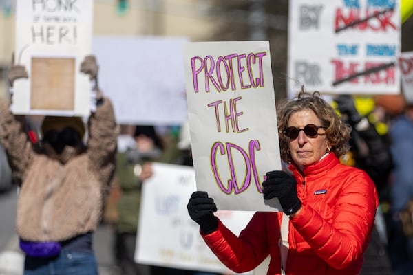 Demonstrators in Atlanta protest President Donald Trump and Elon Musk on Presidents Day as part of nationwide demonstrations organized by the 50501 movement. (Arvin Temkar / AJC)