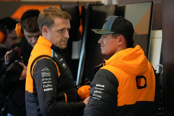 McLaren driver Lando Norris, of Britain, talks with his crew after the final practice session for the Formula One U.S. Grand Prix auto race, Friday, Nov. 22, 2024, in Las Vegas. (AP Photo/John Locher)