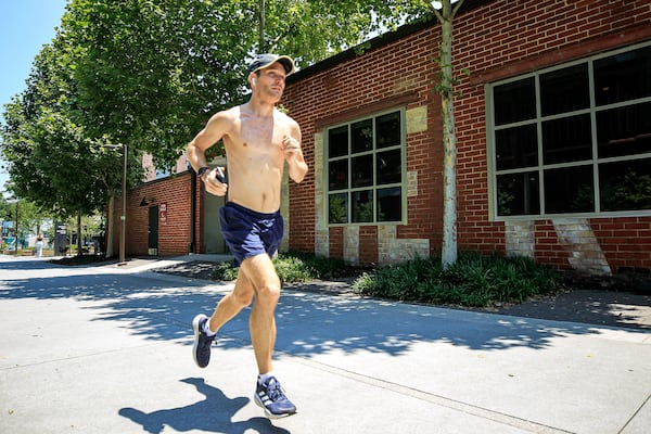 A runner runs across a trail by Krog Street Market in Atlanta, Georgia on Thursday, June 13, 2024.   (Ziyu Julian Zhu / AJC)