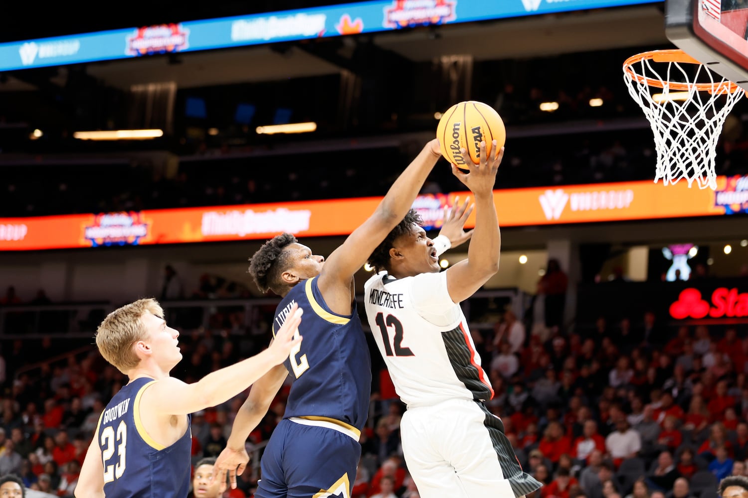 Bulldogs forward Matthew-Alexander Moncrieffe goes up for a shot against Fighting Irish forward Ven-Allen Lubin during the first half Sunday night at State Farm Arena. (Miguel Martinez / miguel.martinezjimenez@ajc.com)