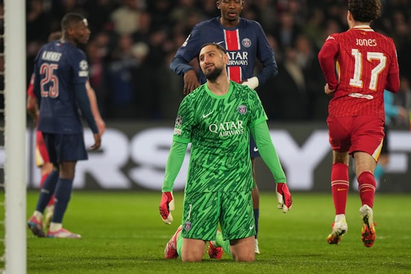 PSG's goalkeeper Gianluigi Donnarumma reacts after conceding the opening goal during the Champions League round of 16 first leg soccer match between Paris Saint-Germain and Liverpool at the Parc des Princes in Paris, Wednesday, March 5, 2025. (AP Photo/Aurelien Morissard)