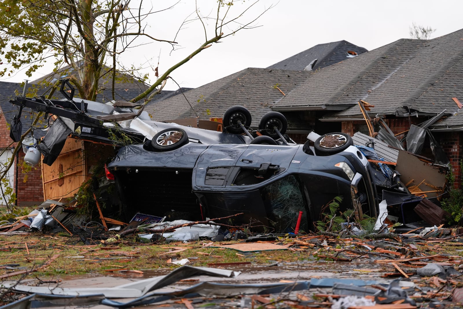 Damage from a tornado is seen along Pinewood Drive in Oklahoma City, Sunday, Nov. 3, 2024. (Bryan Terry/The Oklahoman via AP)