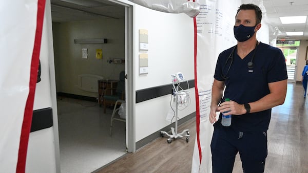 In this file photo, Dr. Jason Laney walks back to an intensive care unit at Jeff Davis Hospital in Hazlehurst. (Hyosub Shin / Hyosub.Shin@ajc.com)