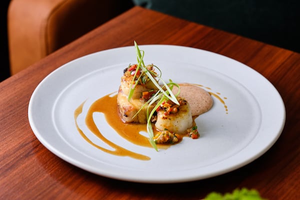 At Nadair, nearly every dish touches their Demant-made grill, like the scallop and pork belly with cornbread puree and warm pepper relish. (Courtesy of Nadair / Brandon Amato)