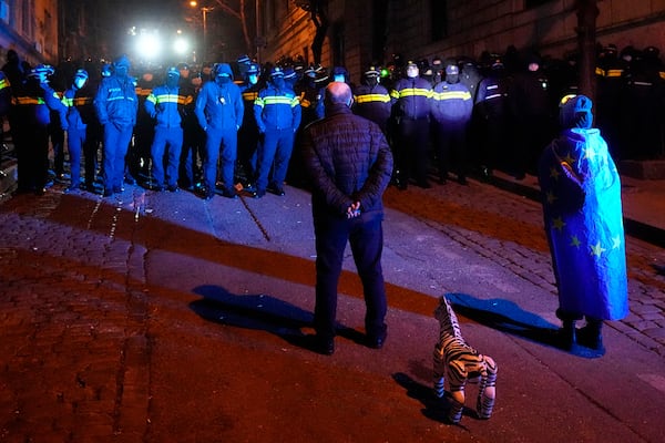 Police block demonstrators during a rally outside the parliament to protest the government's decision to suspend negotiations on joining the European Union in Tbilisi, Georgia, on Wednesday, Dec. 4, 2024. (AP Photo/Pavel Bednyakov)