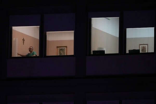 A man walks in the ward where Pope Francis is hospitalized at the Agostino Gemelli Polyclinic, in Rome, Italy, Sunday, March 2, 2025. (AP Photo/Andrew Medichini)