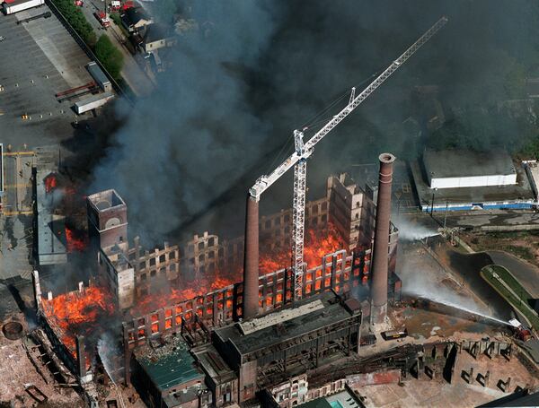 1999: Fire guts the eastern building in the Fulton Cotton Mill complex in Cabbagetown. A worker stranded on the crane had to be rescued by helicopter as the city watched.  