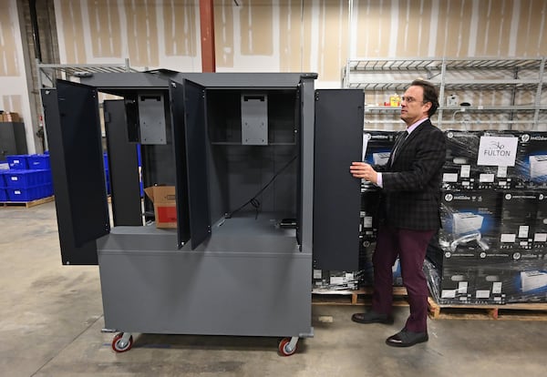 Richard Barron, Director of Registration and Elections for Fulton County, shows the main unit of the new voting machine at Fulton County Election Preparation Center in Atlanta on Tuesday, Jan. 21, 2020. Truckloads of voting machines are arriving at a large Atlanta-area warehouse, where workers are unloading piles of cardboard boxes before a critical deadline: the March 24 presidential primary. (Hyosub Shin / Hyosub.Shin@ajc.com)