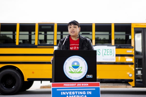 Lux Ho, member of the Moms Clean Air Force, speaks during a press conference announcing $400 million in grant funding for clean school buses from the U.S. Environmental Protection Agency on Wednesday, May 17, 2023, at the Michelle Obama STEM Academy in Hampton, Georgia. The grants will fund the replacement of diesel school buses with zero-emission school buses. CHRISTINA MATACOTTA FOR THE ATLANTA JOURNAL-CONSTITUTION. 