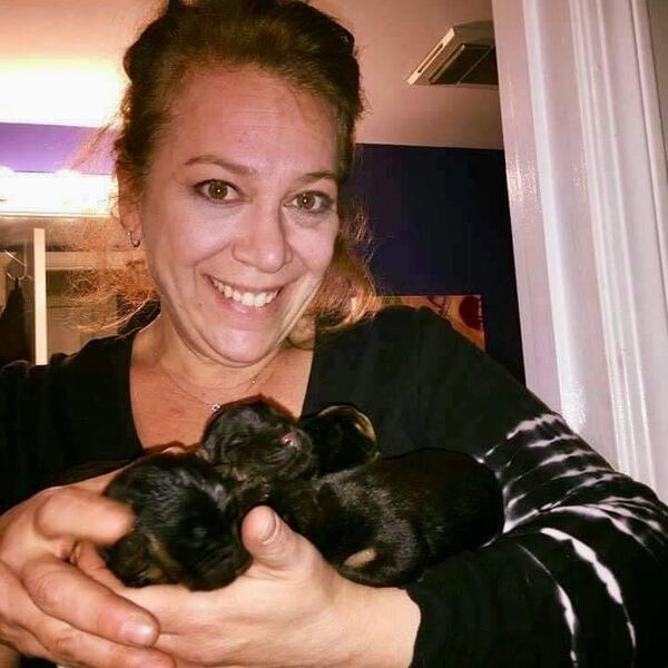 Founder and director of Bosley's Place, Jennifer Siegel, is shown here holding a litter of new intakes.