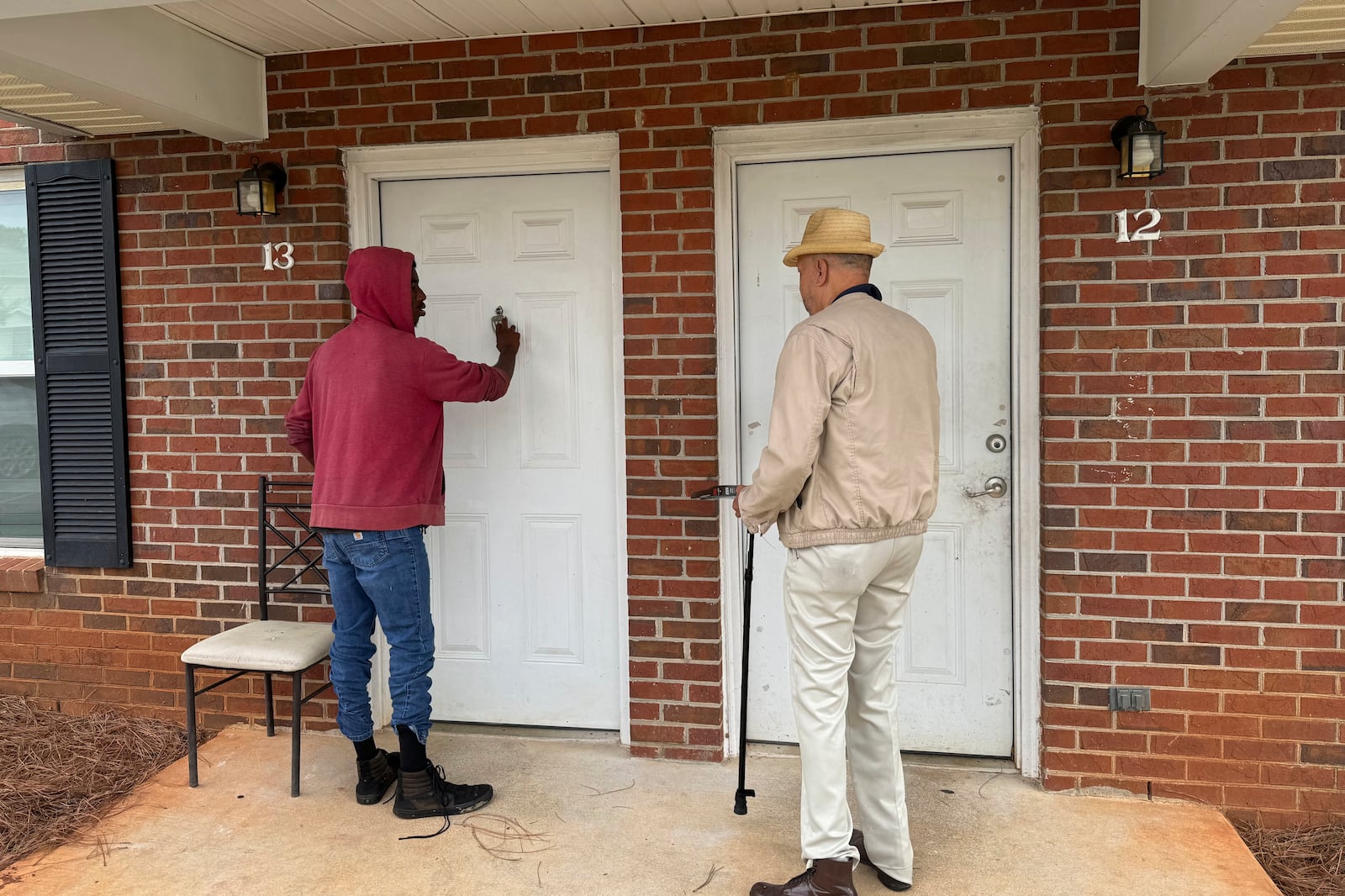 Delvin Blackwell and the Rev. Ezekiel Holley knock on doors to mobilize voters in Georgia's Terrell County on Oct. 5, 2024. (AP Photo/Charlotte Kramon)