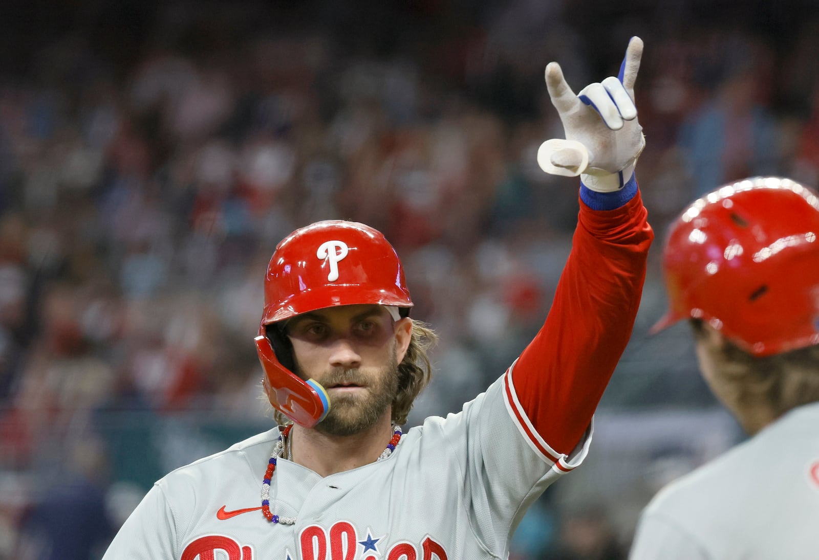 Philadelphia Phillies designated hitter Bryce Harper celebrates his home run in the 6th inning during Game 1 of the NLDS at Truist Park in Atlanta on Saturday, Oct. 7, 2023.  (Miguel Martinez / Miguel.Martinezjimenez@ajc.com)