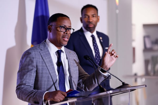 Beltline President and CEO Clyde Higgs, flanked by Atlanta Mayor Andre Dickens, announces the acquisition of the Elleven45 Lounge land to start the Segment 2 trail in the Buckhead area during a news conference on Thursday, Nov. 7, 2024. (Miguel Martinez/AJC)