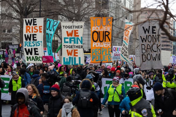 People march with the People’s March in Washington, D.C. on Saturday, January 18, 2025. (Arvin Temkar / AJC)