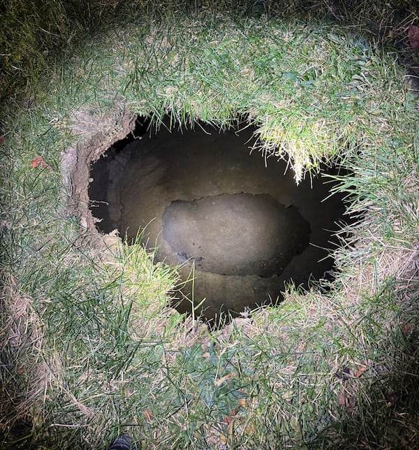 This Tuesday, Dec. 3, 2024. image provided by the Pennsylvania State Police shows the top of a sinkhole in the village of Marguerite, Pa., where rescuers were searching for a woman who disappeared. (Pennsylvania State Police via AP)