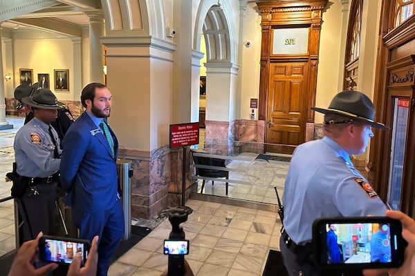 FILE - Georgia state Sen. Colton Moore, R-Trenton, is led out of the Georgia Capitol in handcuffs on Thursday, Jan. 16, 2025, after he was denied entry to the state House and arrested after a shoving match in Atlanta. (AP Photo/Jeff Amy,File)