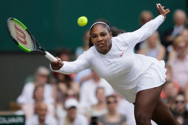 Serena Williams of the United States returns the ball to Germany's Angelique Kerber during their women's singles final match at the Wimbledon Tennis Championships, in London, Saturday July 14, 2018.