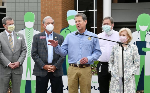 Early in the pandemic, Floyd Medical Center in northwest Georgia was deluged with COVID-19 patients after the area suffered one of the state's first outbreaks.  The state helped fund extra resources for the hospital.  Here, Governor Brian Kemp speaks after he toured a temporary medical pod and a pop-up hospital in the parking garage at Floyd Medical Center on May 13, 2020. (PHOTO by Hyosub Shin / Hyosub.Shin@ajc.com)