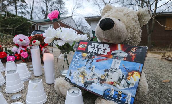 A makeshift memorial was placed overnight in Atlanta’s Mozely Park neighborhood where an F.L. Stanton Elementary student was fatally mauled by dogs while walking to a school bust stop Jan. 17. A second child was severely injured. Residents of Westside neighborhoods complain that unleashed dogs routinely rove the neighborhood. JOHN SPINK /JSPINK@AJC.COM