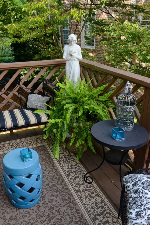 A back deck allows homeowners Jeffrey Chandler and Pedro Ayestaran Diaz plenty of space to get outside and enjoy the mature trees and azaleas in their townhome community. Text by Lori Johnston and Keith Still/Fast Copy News Service. (Christopher Oquendo Photography/www.ophotography.com)