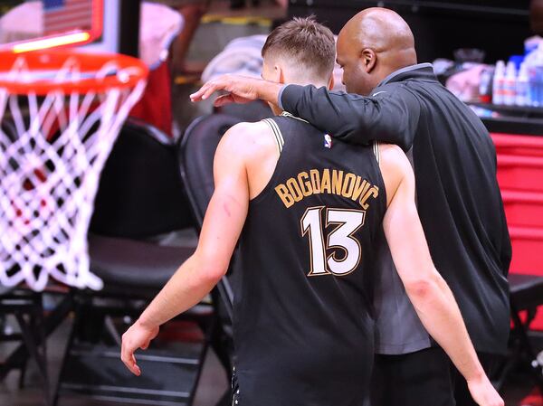 Hawks coach Nate McMillan and guard Bogdan Bogdanovic walk off the court together after falling to the Milwaukee Bucks 118-107 in game 6 of the NBA Eastern Conference Finals on Saturday, July 3, 2021, in Atlanta.   “Curtis Compton / Curtis.Compton@ajc.com”