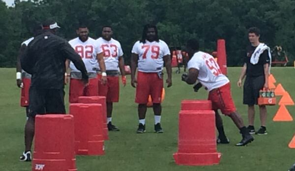 Falcons defensive tackle Grady Jarrett going through the paces under the watchful eye of Bryan Cox. (D. Orlando Ledbetter/DLedbetter@ajc.com)