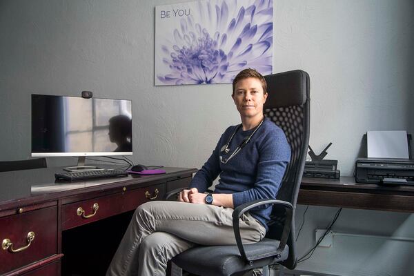 Dr. Izzy Lowell poses for a photo at her practice, Queer Med, in the Decatur office, Tuesday, February 4, 2020. Dr. Lowell, a family medicine physician, started Queer Med to fill gaps in the care for transgender and nonbinary patients of all ages. Queer Med, or Q Med, offers hormonal therapy and Name/Gender Marker change letters for patients.  (ALYSSA POINTER/ALYSSA.POINTER@AJC.COM)