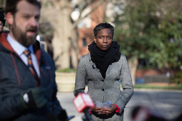 Atlanta Inspector General Shannon Manigault prepares to make remarks behind her attorney, James Radford, outside of Atlanta City Hall on Feb. 17. (Riley Bunch/AJC)