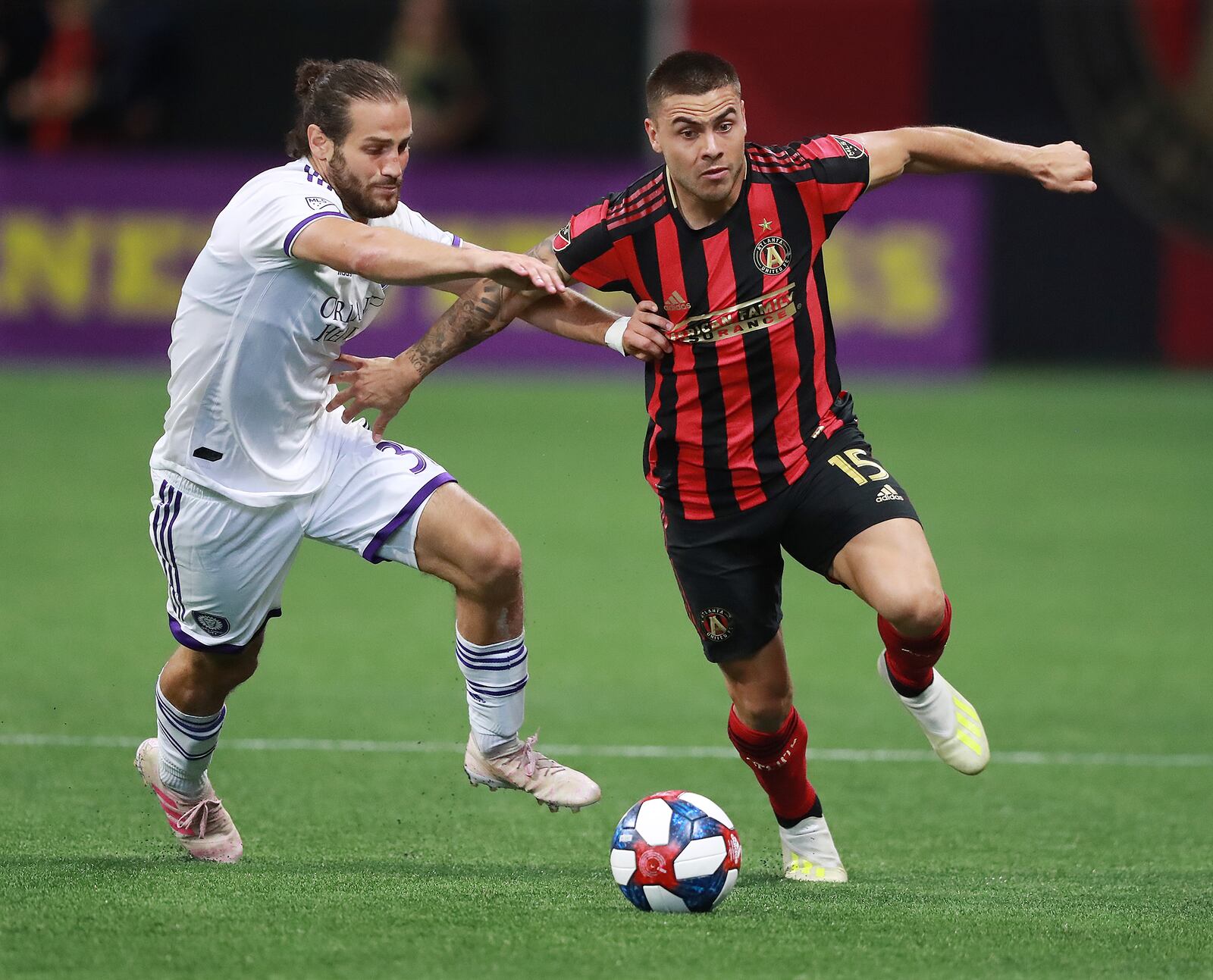 May 12, 2019 Atlanta: Atlanta United forward Hector Villalba drives past Orlando City defender Alex De John during the second half in a 1-0 victory during a MLS soccer match on Sunday, May 12, 2019, in Atlanta.  Curtis Compton/ccompton@ajc.com