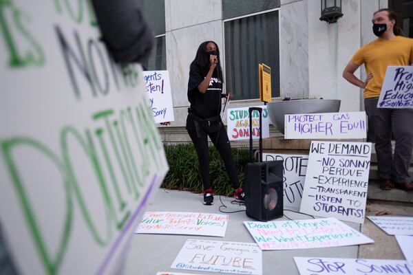 210427-Atlanta- Hannah Gebresilassie with Protect the Vote GA leads a protest in front of the University System of Georgia offices in Downtown Atlanta on Tuesday afternoon, April 27, 2021, against former Gov. Sonny Perdue becoming the new chancellor. Ben Gray for the Atlanta Journal-Constitution