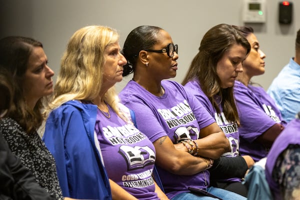 People show up in support of Cobb County teacher Katie Rinderle, who read “My Shadow is Purple,” a book about gender identity, to fifth graders, at a hearing at the Cobb County Board of Education in Marietta on Thursday, Aug. 10, 2023. Rinderle was fired by the school board on Thursday, Aug. 17, 2023. (Arvin Temkar / arvin.temkar@ajc.com)